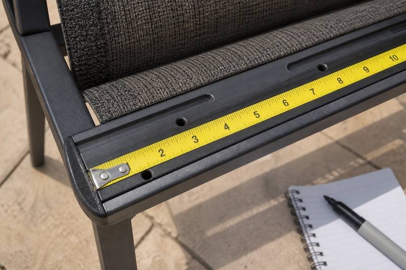 Measure Patio Sling - Person measuring chaise lounge frame